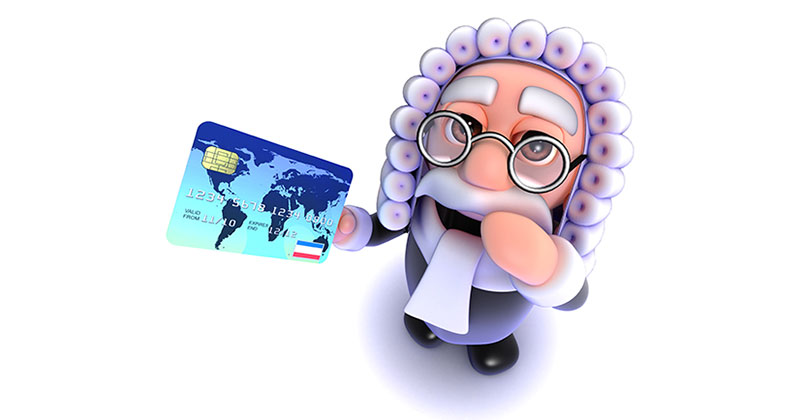 Smiling judge holding a credit card