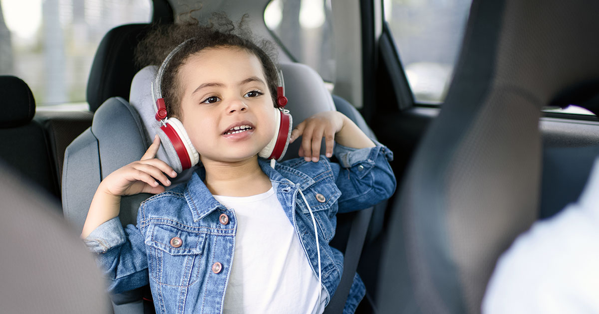 https://timtab.com/static/img/special/80-20-child-custody-schedules/girl-listening-music-backseat-car.jpg