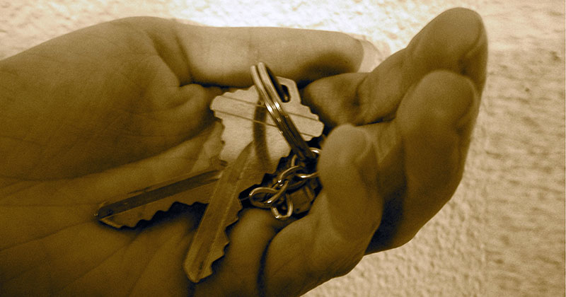 Man holding house keys